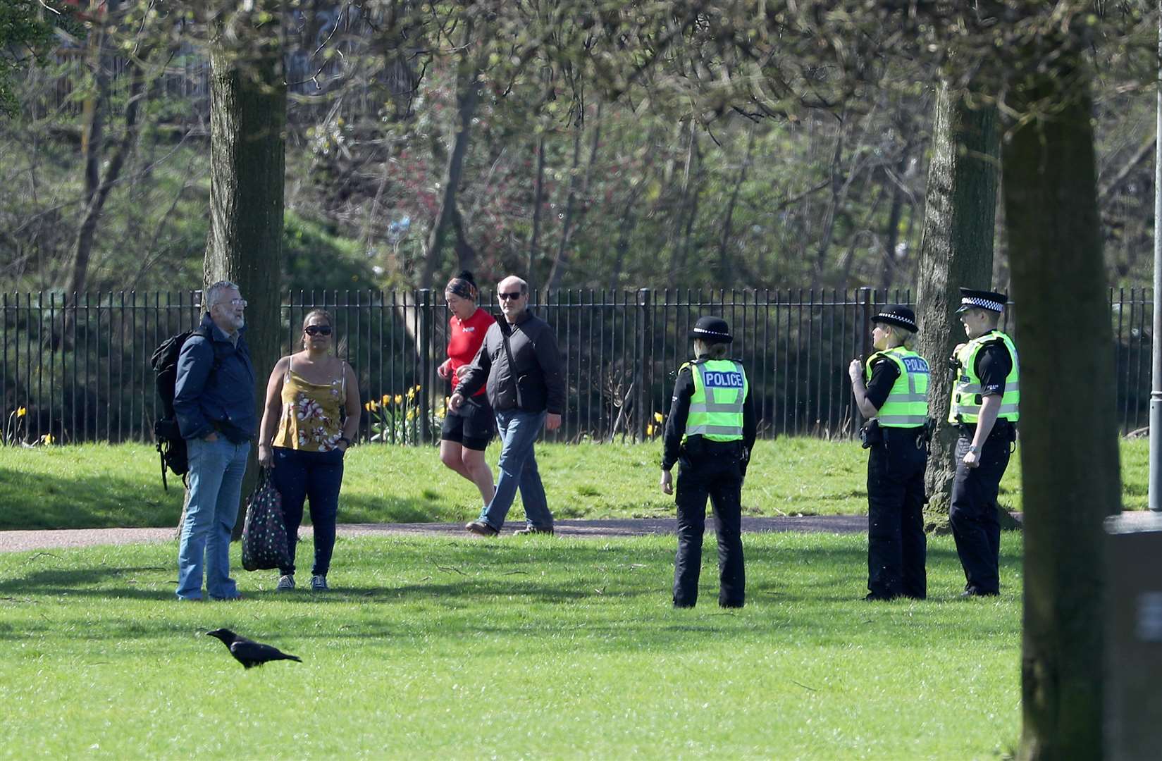 Police officers chat to park users in Glasgow Green (Andrew Milligan/PA)