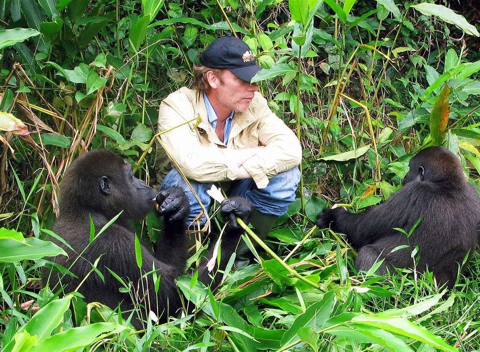 Conservationist Damian Aspinall with gorillas in Gabon in 2010