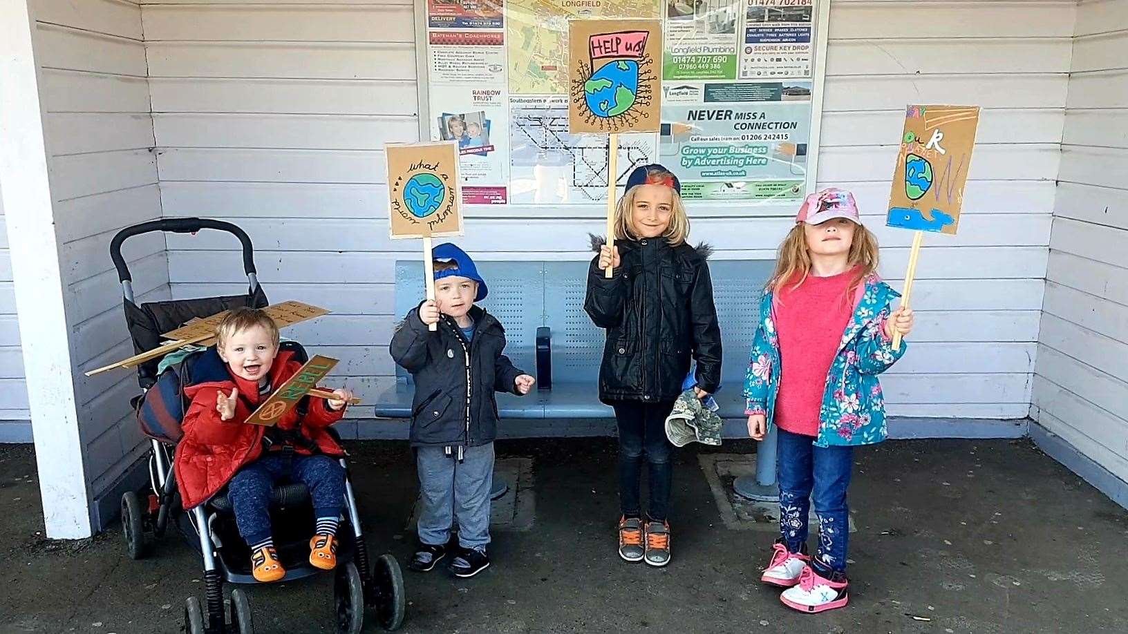 L/R: Dexter, one, Zac, three, Leo, six, and Amelia, five, on their way to climate change protests in London (9036915)