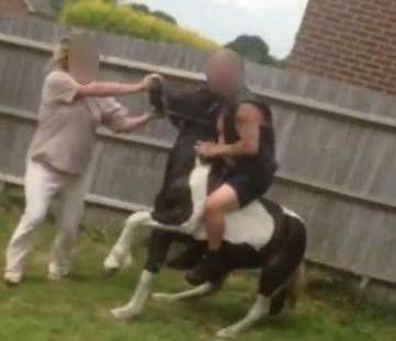 The man is filmed riding the young horse, which is thought to be between one and two years old