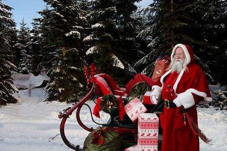 Father Christmas with his sleigh and presents