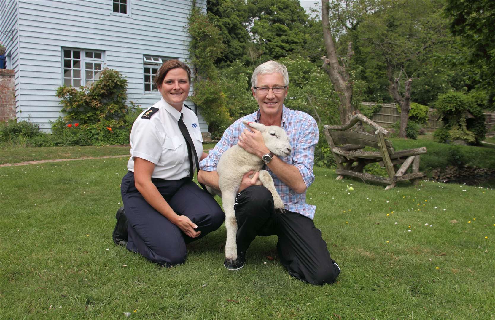 O'Grady with RSPCA inspector Caroline Hall and Winston the lamb in 2011. Picture: RSPCA