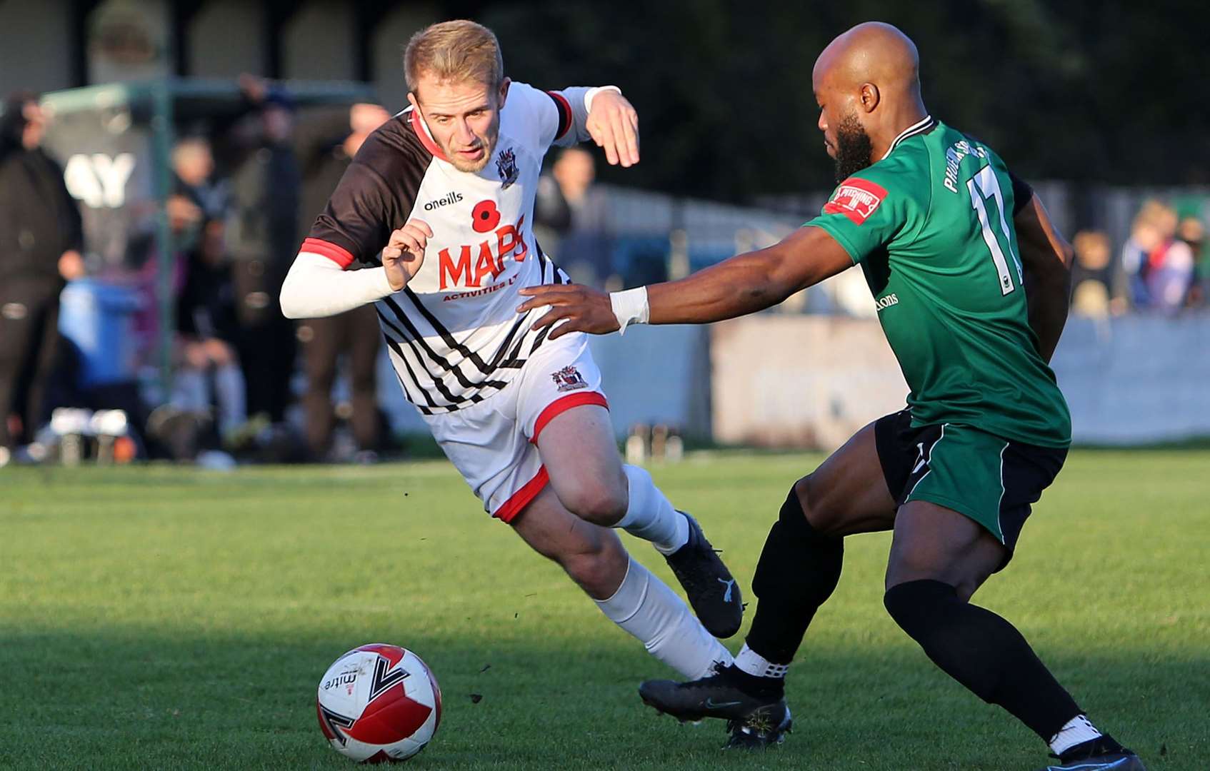 Billy Munday of Deal beats Francis Babalola of Phoenix Sports before crossing for Deal's opener. Picture: Paul Willmott