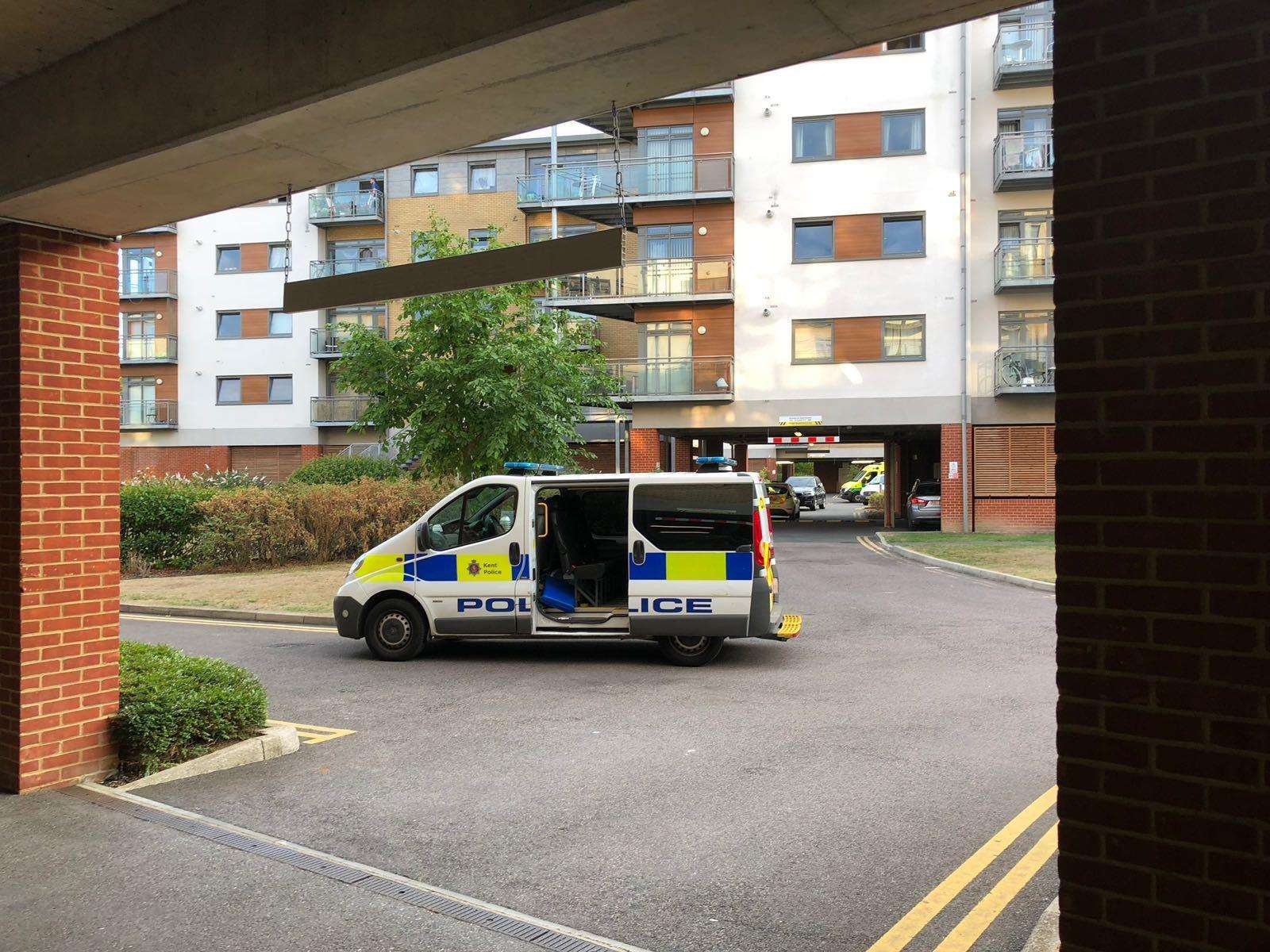 Four police cars and three ambulances were seen at Wallis Place flats off Hart Street in Maidstone