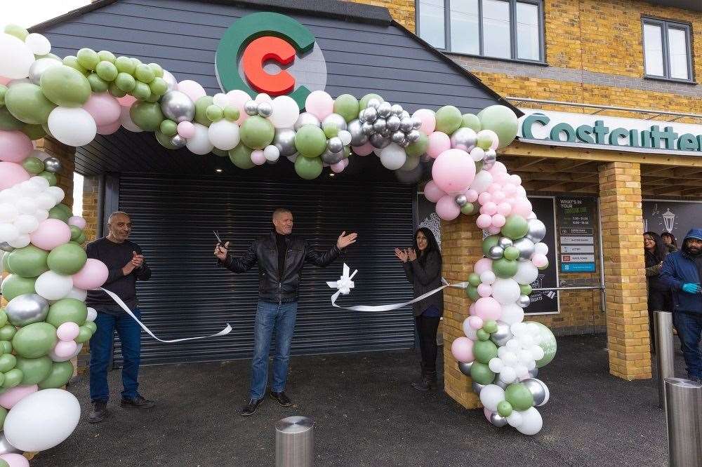 Mark cut the ribbon announcing the store open
