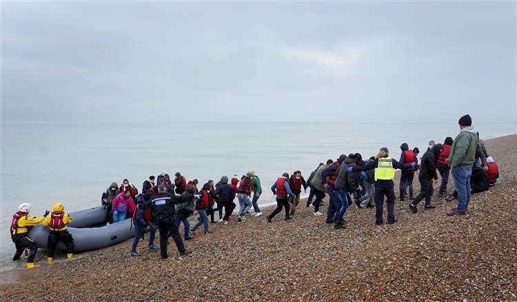 A group of asylum seekers brought in to Dungeness by the RNLI last November. Picture: Gareth Fuller/PA