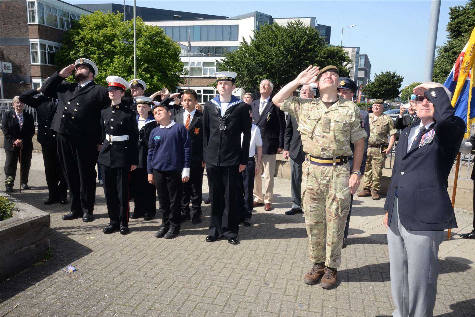 Those present as the Armed Forces Day flag was raised at Canterbury Fire Station on Saturday. Picture: Chris Davey. (13154133)