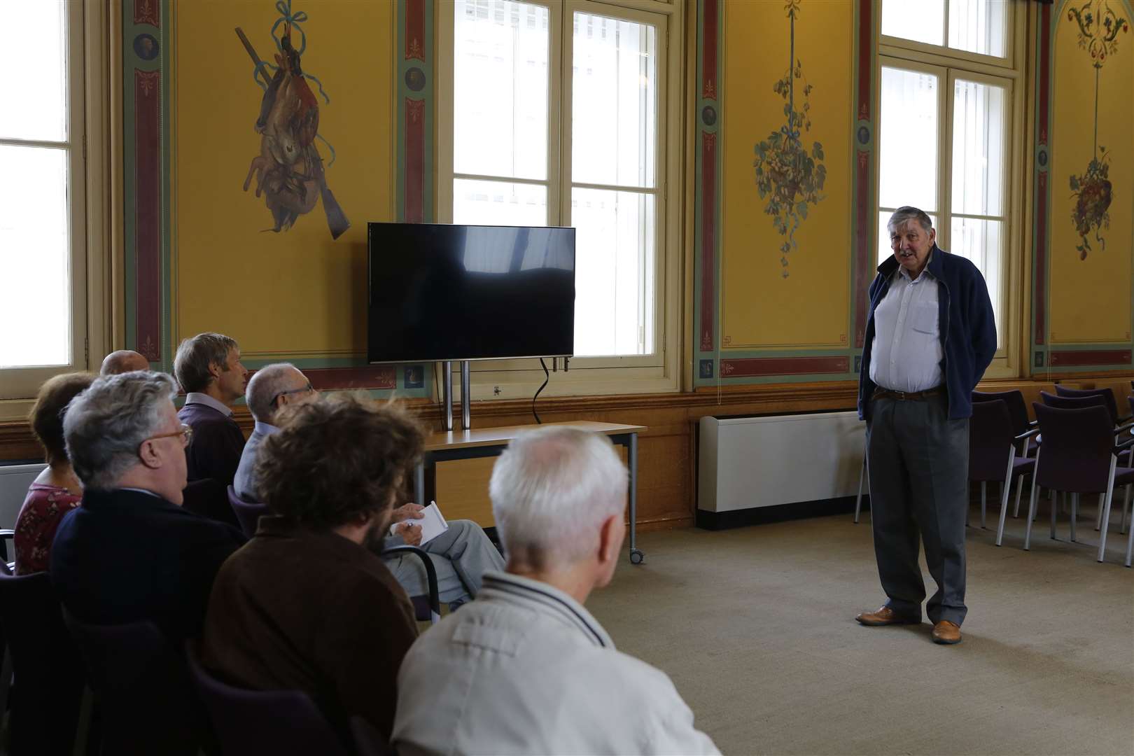Albert Daniels delivering a talk on the town's history at Maidstone Town Hall in 2018