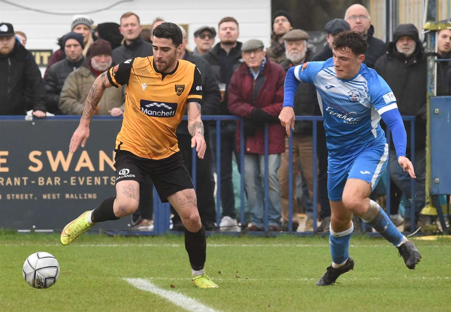 Luke Jenkins keeps tabs on Joan Luque during the Boxing Day derby at Longmead Picture: Steve Terrell