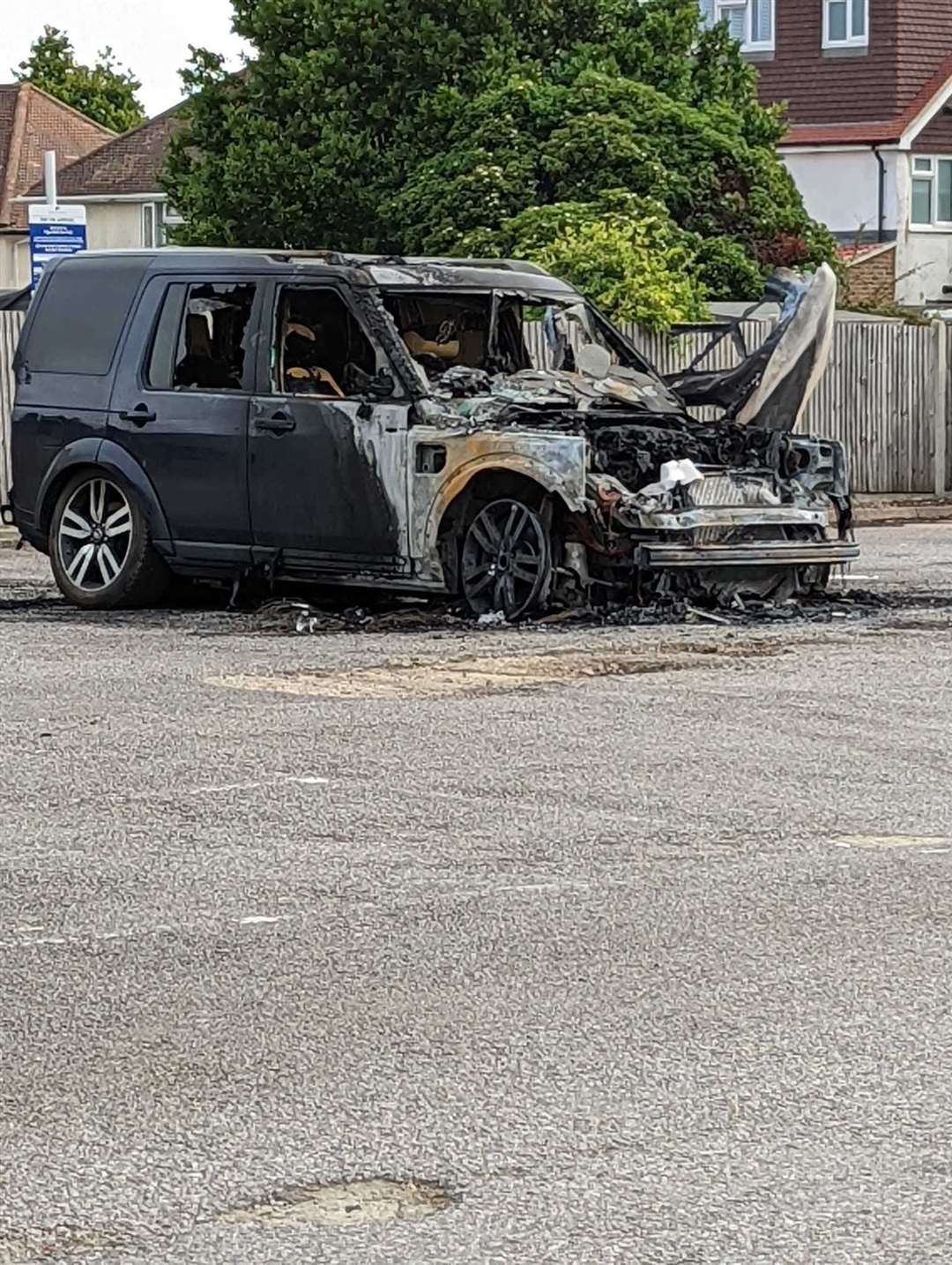 The burnt out car in pub car park