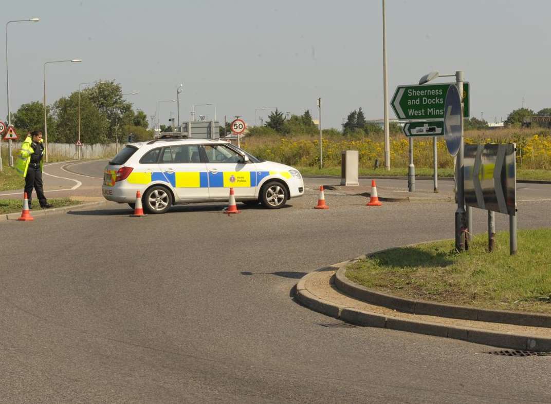 Police mount a road block near the Sheppey crash