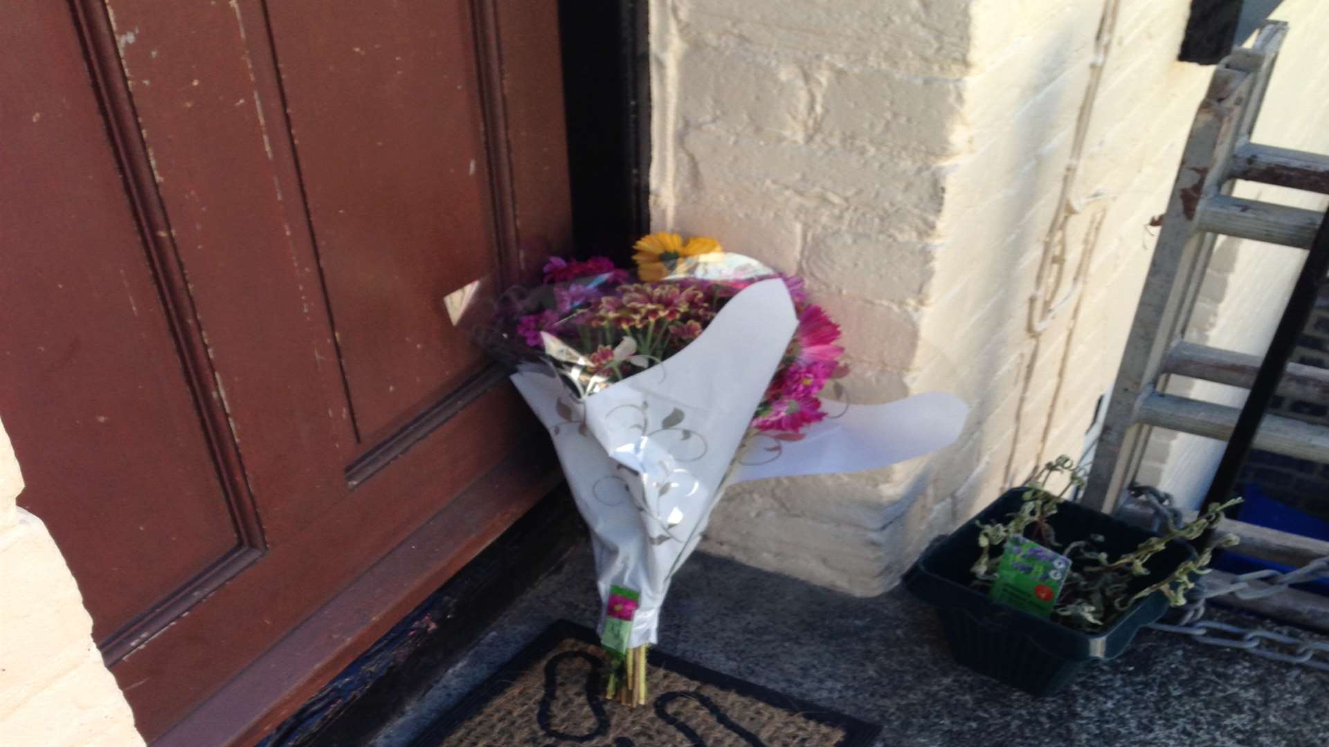 Floral tributes were left out side a house in De Burgh Street, Dover