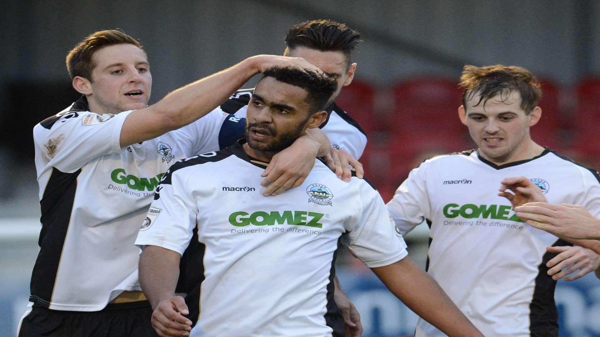 Dover striker Stefan Payne takes the congratulations after scoring the goal which knocked out Morecambe Picture: Gary Browne