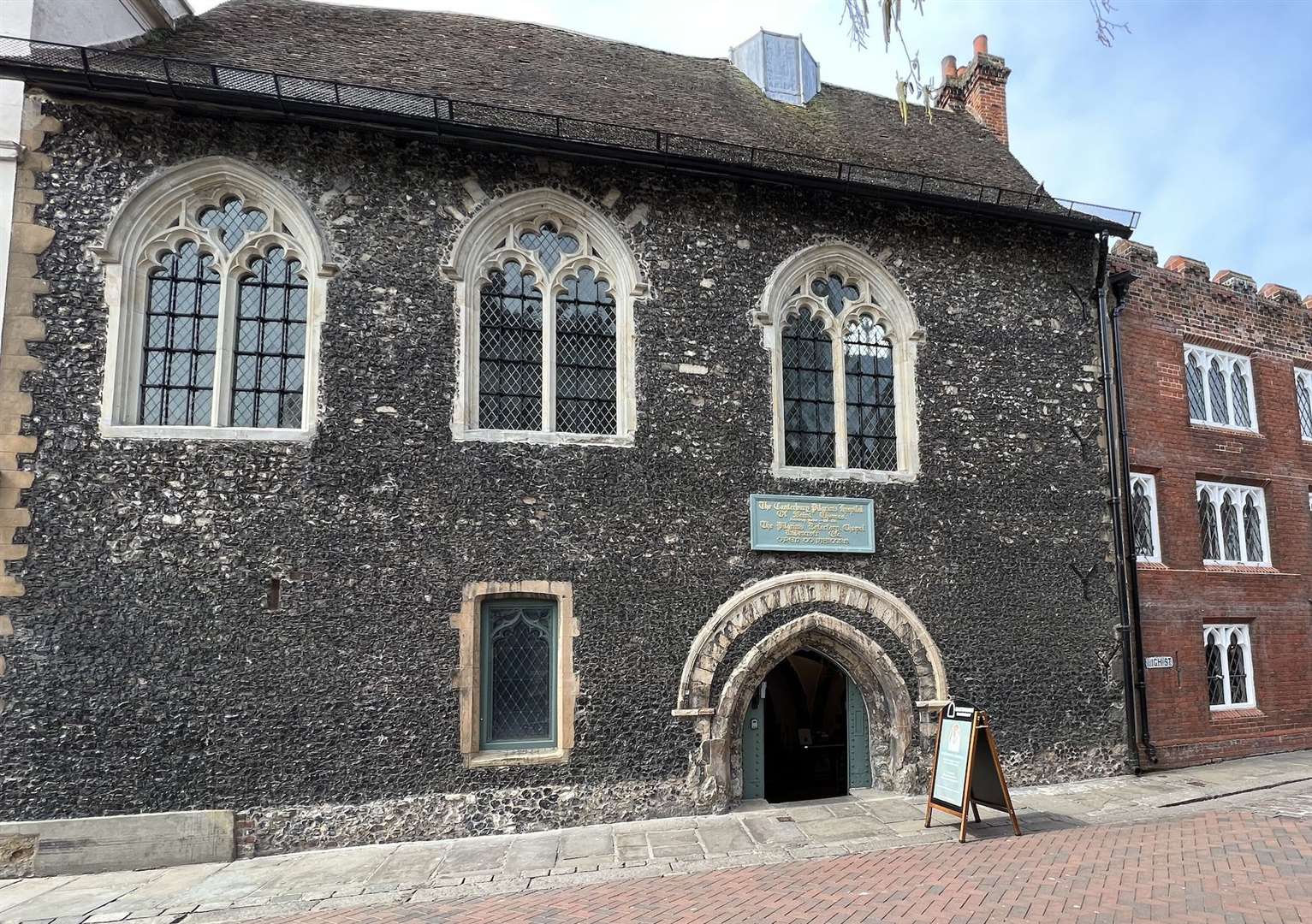 The unassuming Eastbridge Hospital entrance in Canterbury High Street hides a historical gem