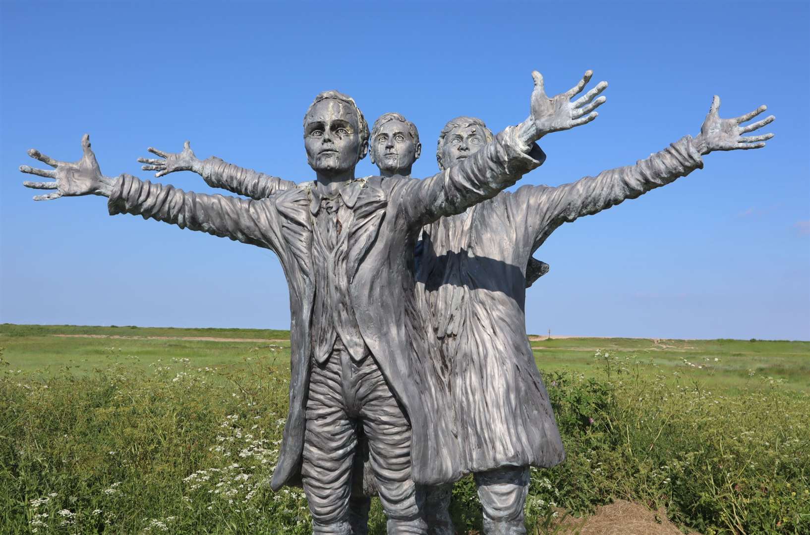 Statue to British aviation pioneers the Short Brothers Oswald, Eustace and Horace who set up the first aircraft factory on the Isle of Sheppey. The statue at Shellness by Muswell Manor is dedicated to the "magnificant makers of flying machines." Picture: John Nurden