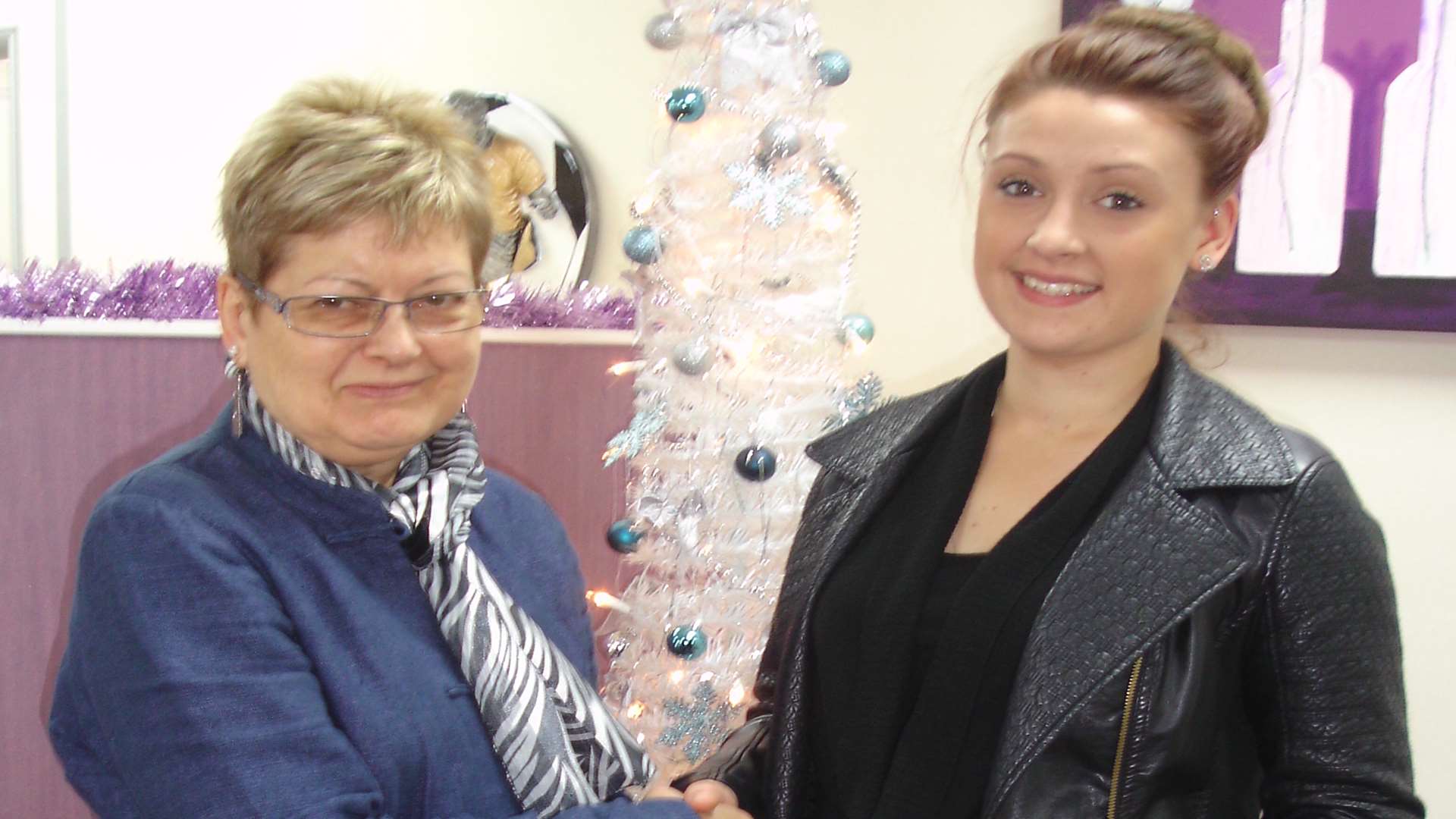 Holly Diamond receives her prize from County Square manager Frances Burt