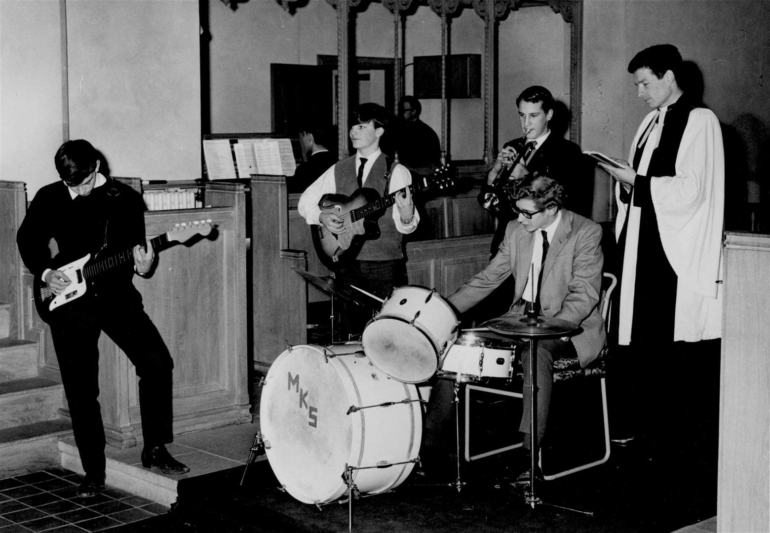 'Something never seen before in Canterbury,' reported the Kentish Gazette in February 1965. An 'Off-Beat Youth Service' in St Mary Bredin Church heard Top 10 tunes such as I'll Never Find Another You and Downtown accompany the hymns. The curate, the Rev John Barton, looks on