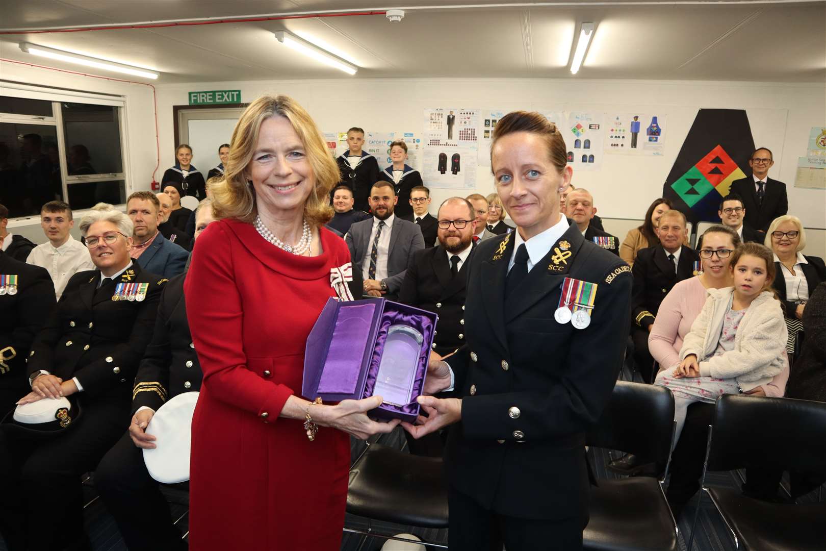 Lord Lieutenant of Kent Lady Colgrain hands over the Queen's Award for Voluntary Service to Commanding Officer Leisse Gambell at Sheppey Sea Cadets' headquarters at Barton's Point, Sheerness