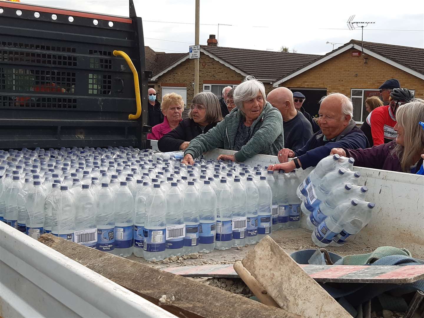 People collecting an emergency water delivery in Herne Bay after water mains burst