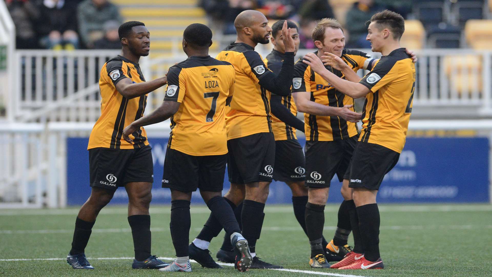 Stones celebrate new boy Darius Osei's strike before Swifts pulled a goal back late on Picture: Gary Browne