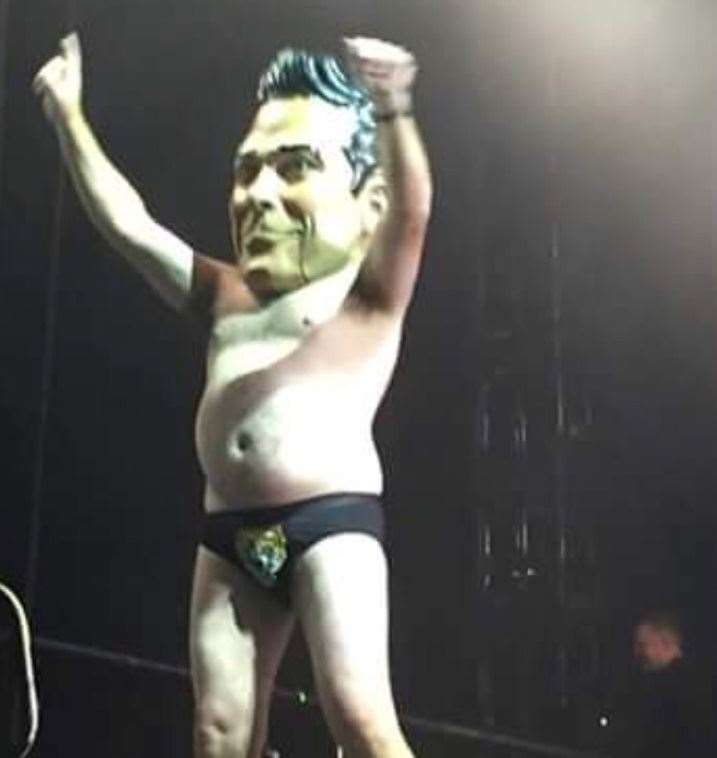 Ade on stage during a Robbie Williams Auckland show - style icon? You decide...