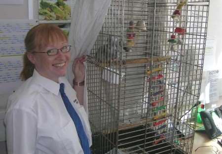 AN INNOCENT BEHIND BARS: Claude being cared for by front counter assistant Claire Fenn at Sittingbourne Police Station