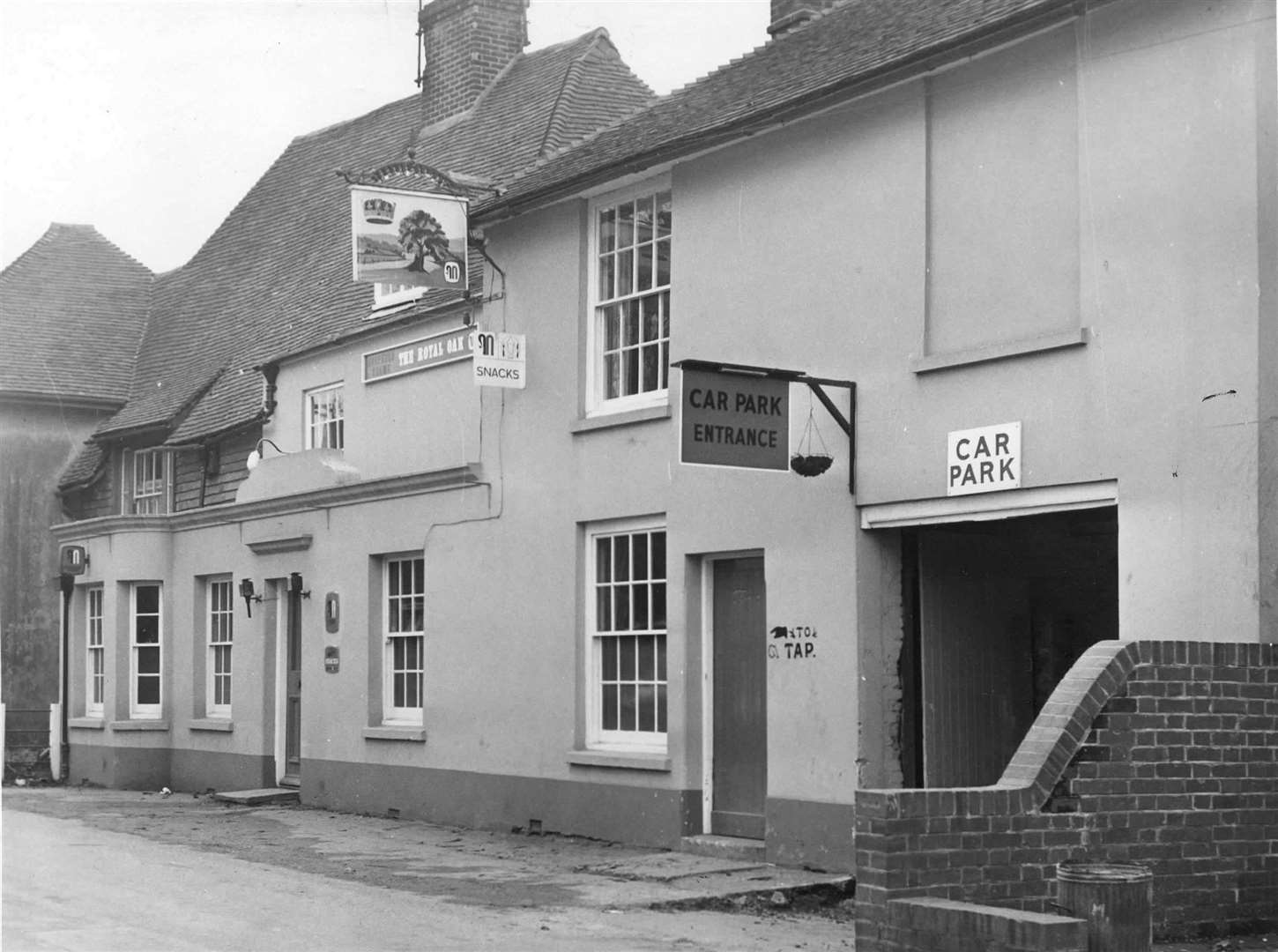 The Royal Oak, which stands on the main road in Mersham, is pictured here in 1974