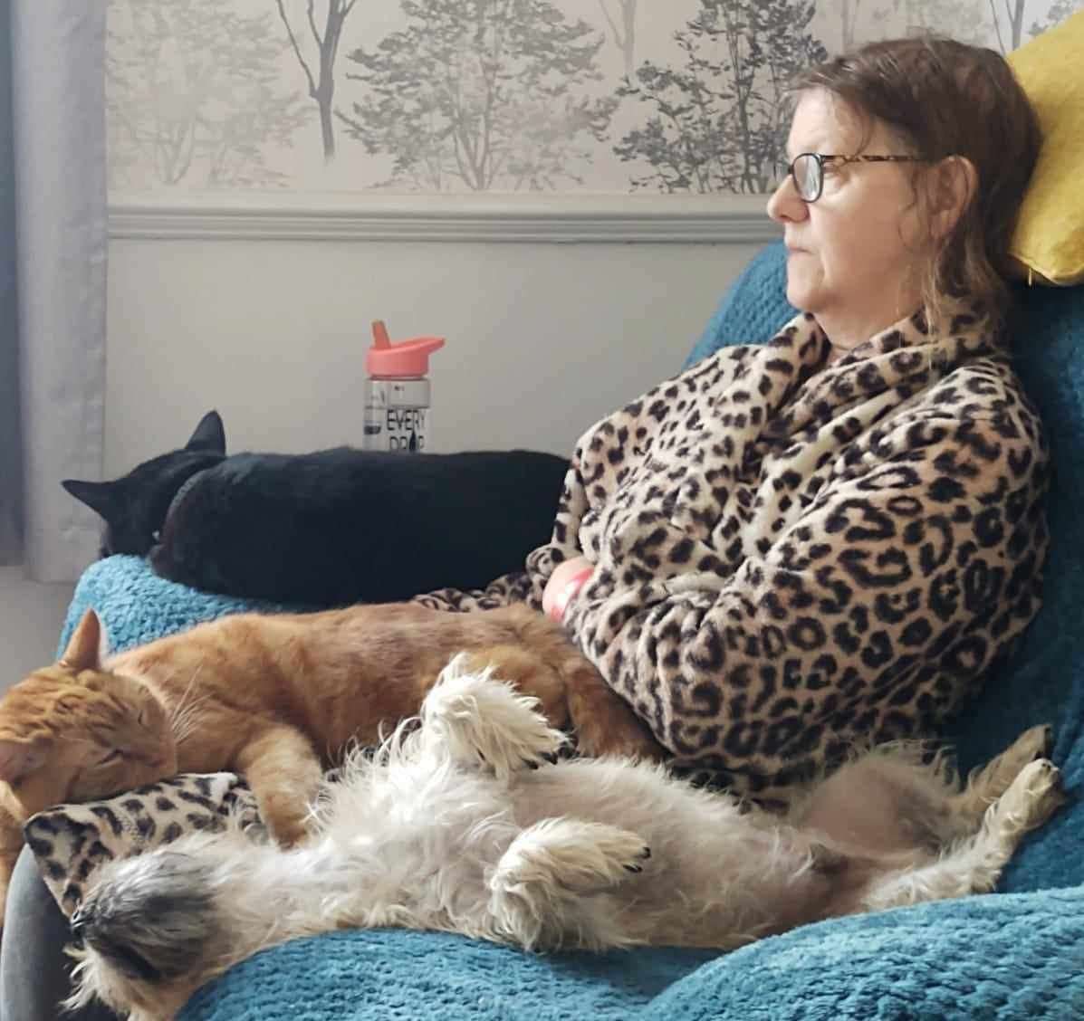 Bronwen, pictured with three of her pets, has now been diagnosed with ALSP