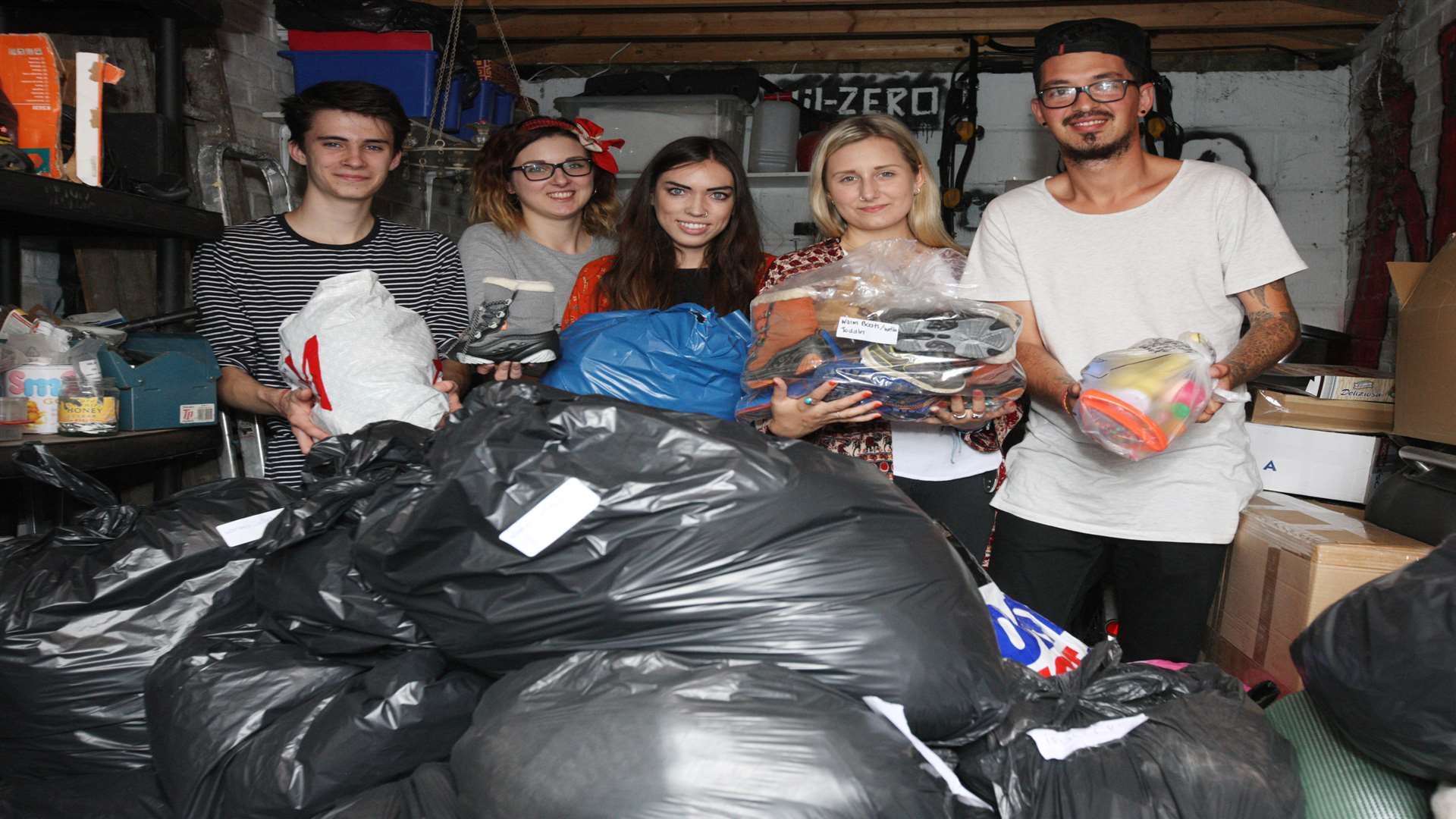The group with some of the donated clothing. Picture: John Westhrop