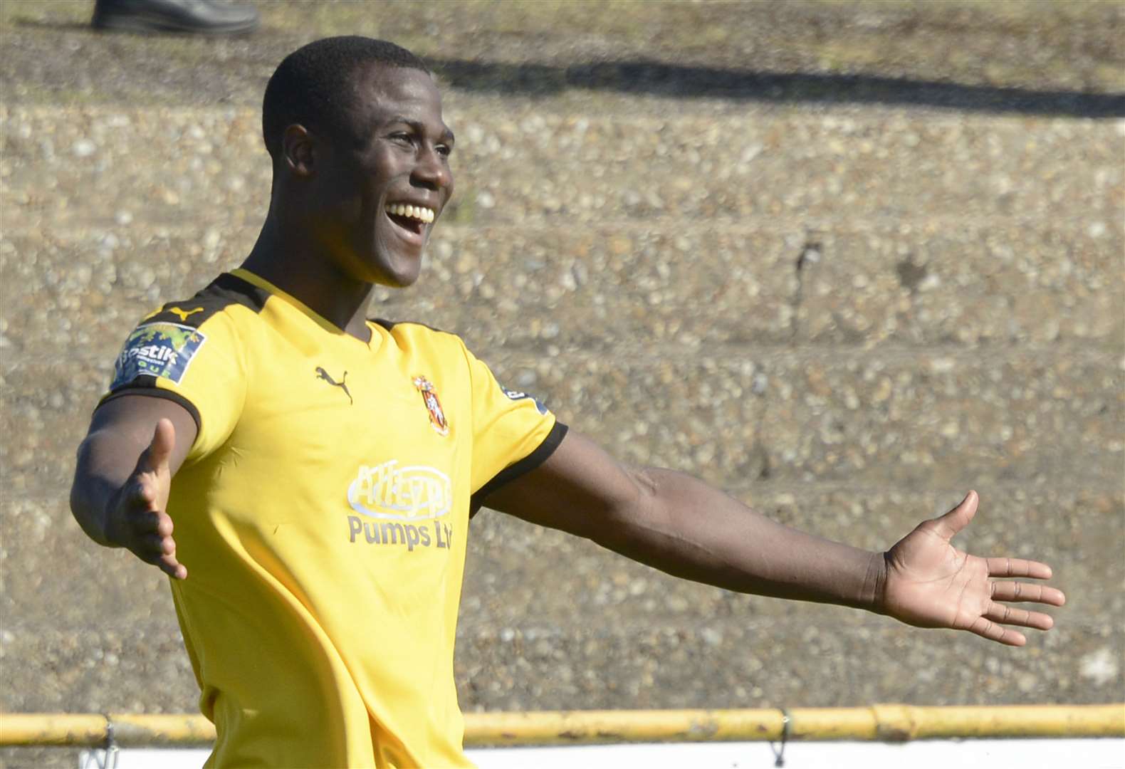 Ade Yusuff celebrates one of his 51 goals for Folkestone Picture: Paul Amos