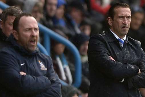 Justin Edinburgh, right, watches on as Gills reach the 50-point mark against Bradford Picture: Barry Goodwin
