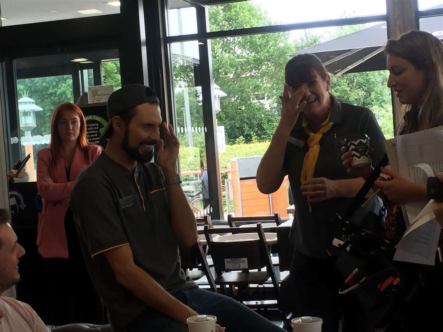 Rylan talking to customers and staff at the Orbital Park McDonald’s