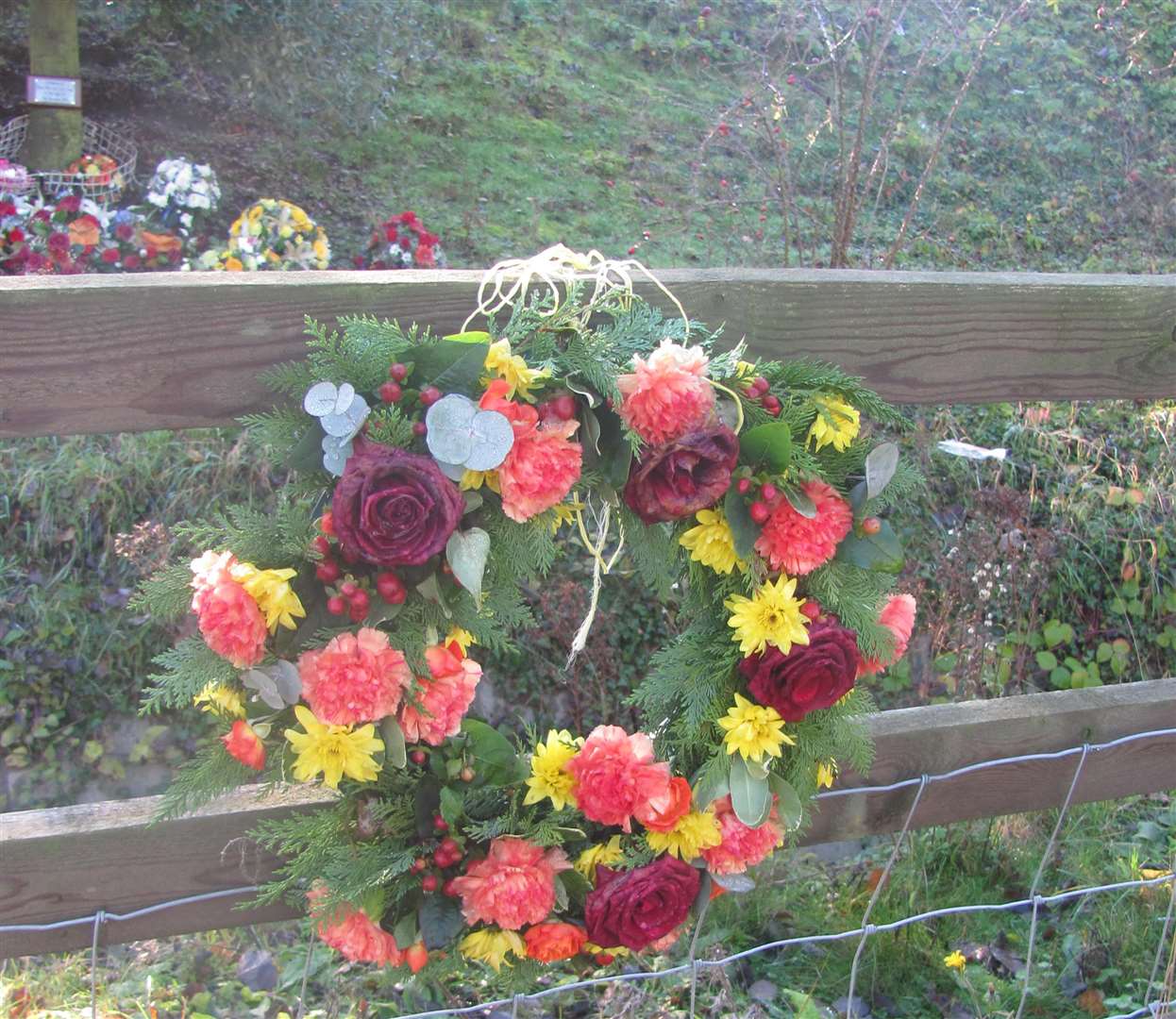 Floral tributes at the scene of the crash near Faversham