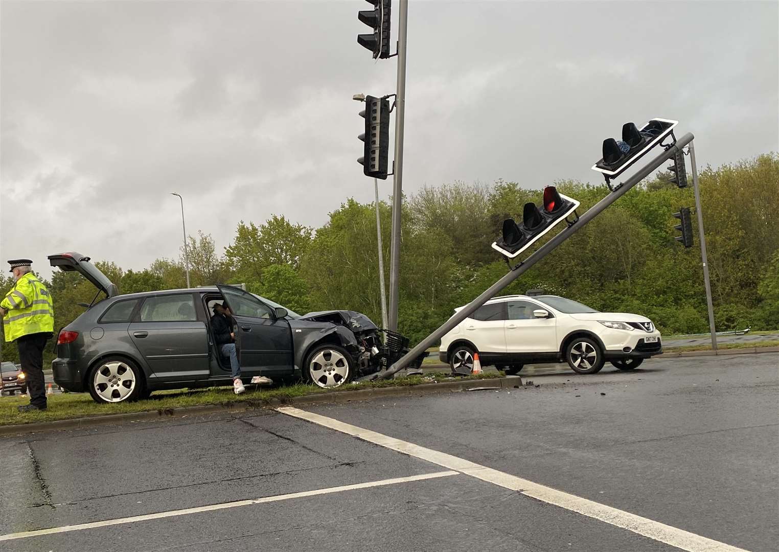 An Audi has demolished a set of traffic lights. Picture: Steve Salter