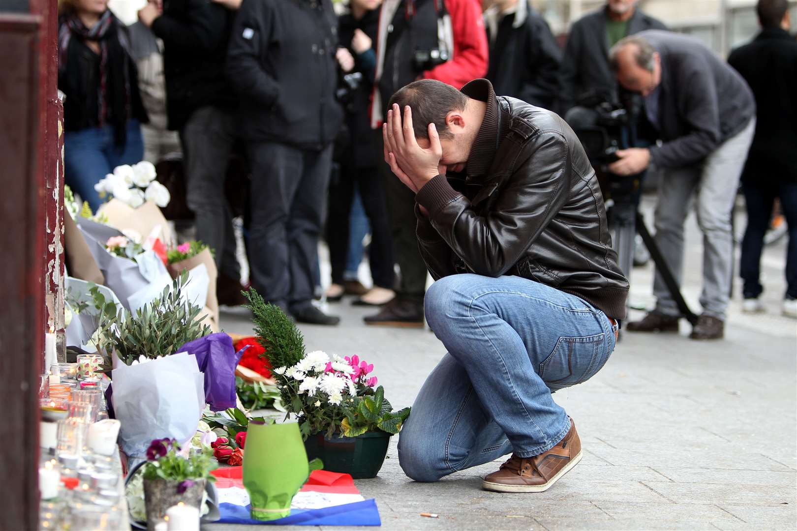 PA Images: Tributes laid outside Le Carillon bar in Paris