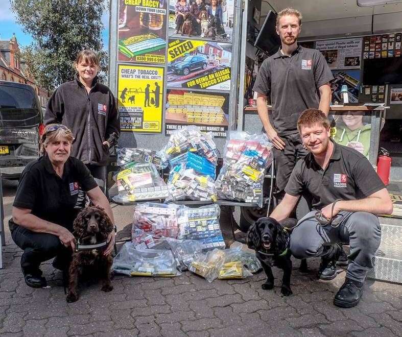 Trading Standards officers pictured following a raid of illegal tobacco products from a shop five years ago