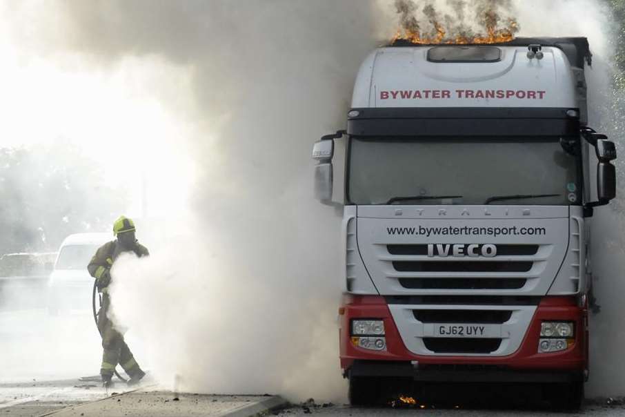 Firefighters battle to control a lorry on fire on the A2 near Faversham. Picture: Ruth Cuerden