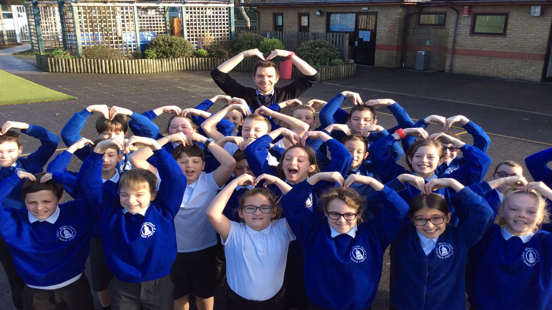 Chris Marston with his class doing The Mobot ready for the marathon