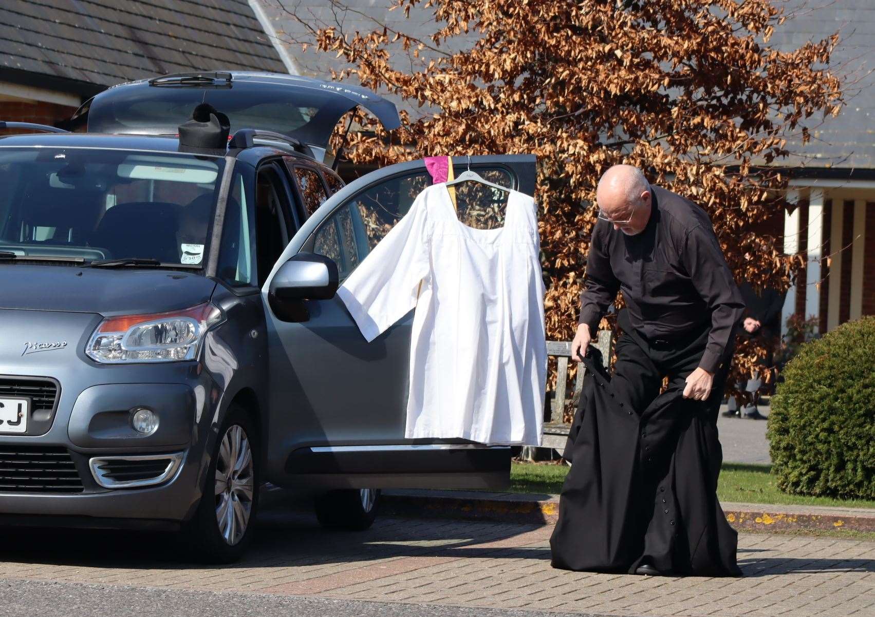 The Rev Colin Johnson from Sheppey forced to change in the car park of the Garden of England Crematorium at Bobbing near Sittingbourne