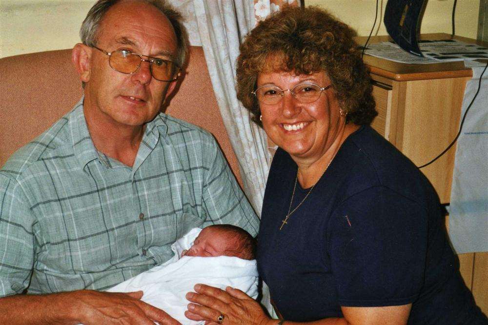 Rosemarie Knight is pictured fit and well with husband Adrian at the birth of her first grandson Jonah in 2003. Three years later, Rosemarie was dead, aged just 58, after a two year battle with motor neurone disease which struck without warning. She is the reason daughter Sharon Cairns, from Ramsgate, is doing a husky marathon to raise funds for the Motor Neurone Disease Association and the Pilgrims Hospice in Margate, where her mum died
