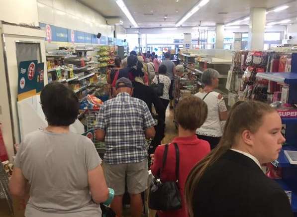 Long queues for Poundland bargains in the Ashford High Street branch today