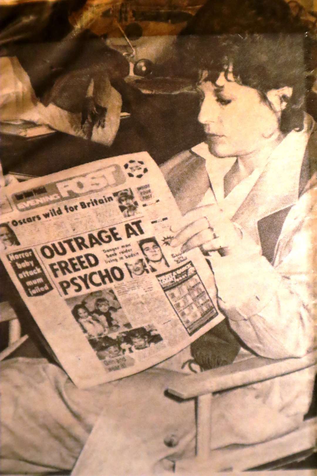 Jill Gascoine reading the Kent Evening Post as she takes a break from filming the TVS drama CATS Eyes in the newspaper's offices in Chatham High Street in March 1985