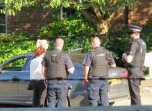 Police at the scene of the car found with bullet holes. Picture: Chris Ferguson