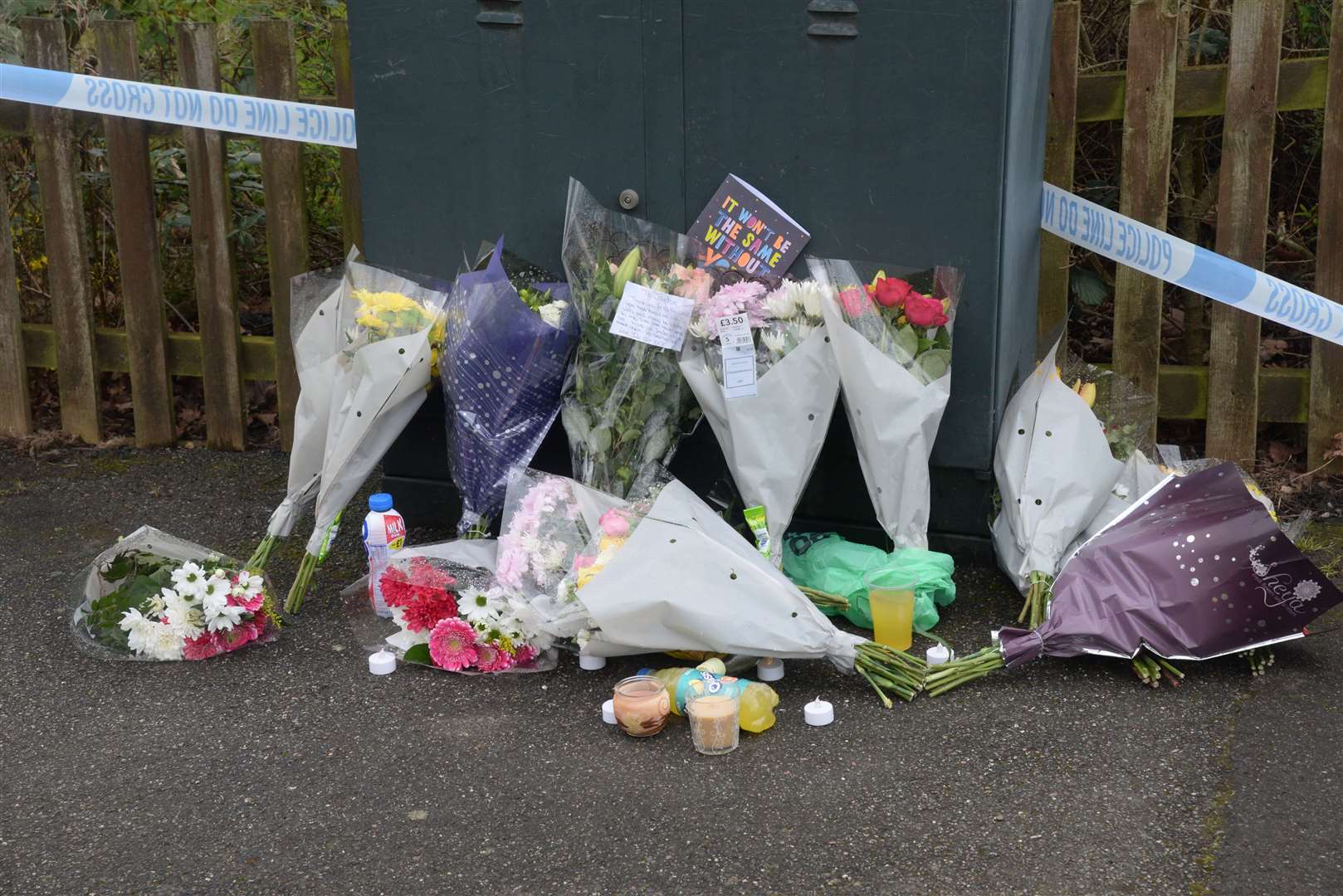 Floral tributes have been left at the scene in Ashford. Picture: Chris Davey