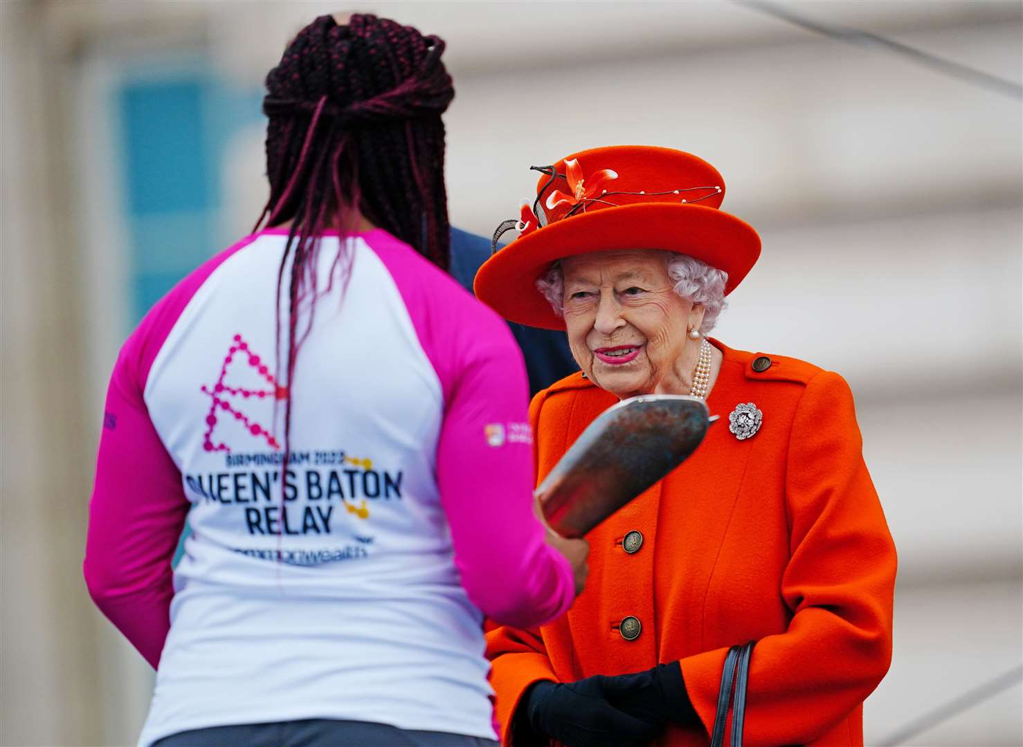 Kadeena Cox receiving the baton from The Queen at the Queen's Baton Relay launch