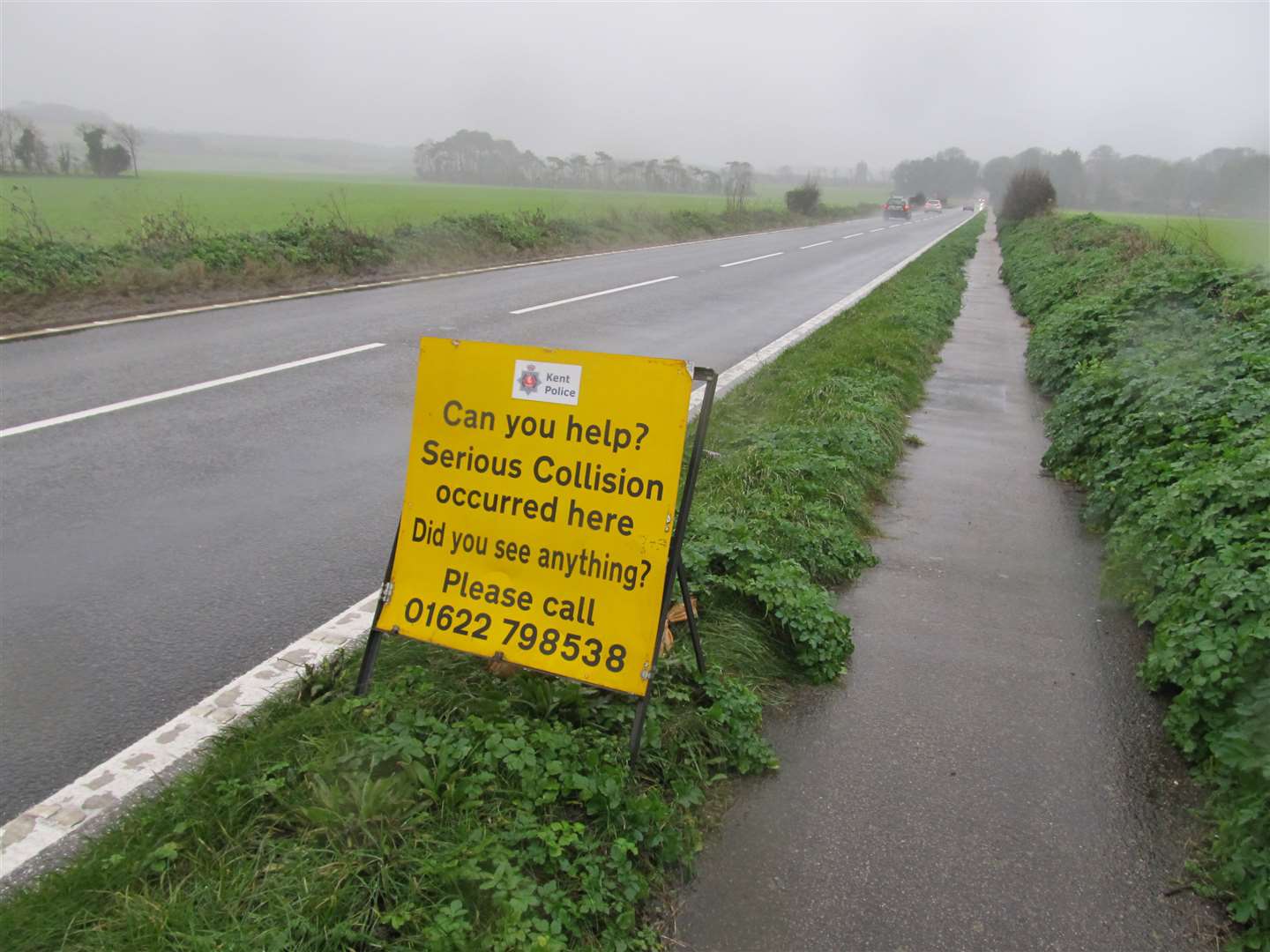 Police appeal sign where pedestrian was killed by a car on the A258