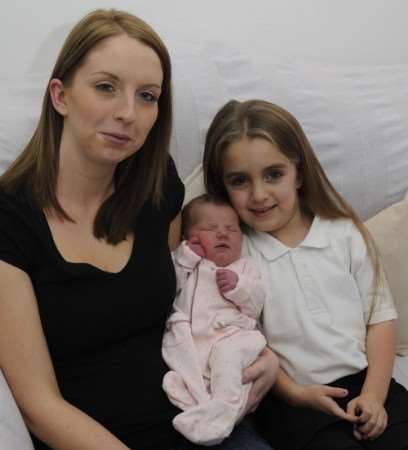 Mum Laura Flood and six-year-old Abigail recover from the drama of baby Carly's dramatic birth