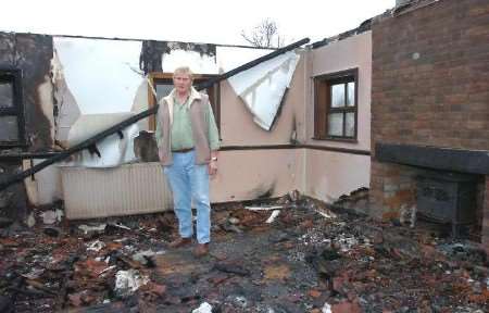 The owner Tony Wilson stands in the remains of the converted stable block. Picture: MATT WALKER