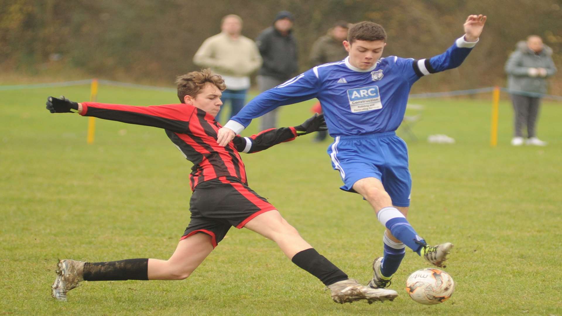 New Road under-16s (blue) try to get away from Meopham Colts Black under-16s on Sunday. Picture: Steve Crispe