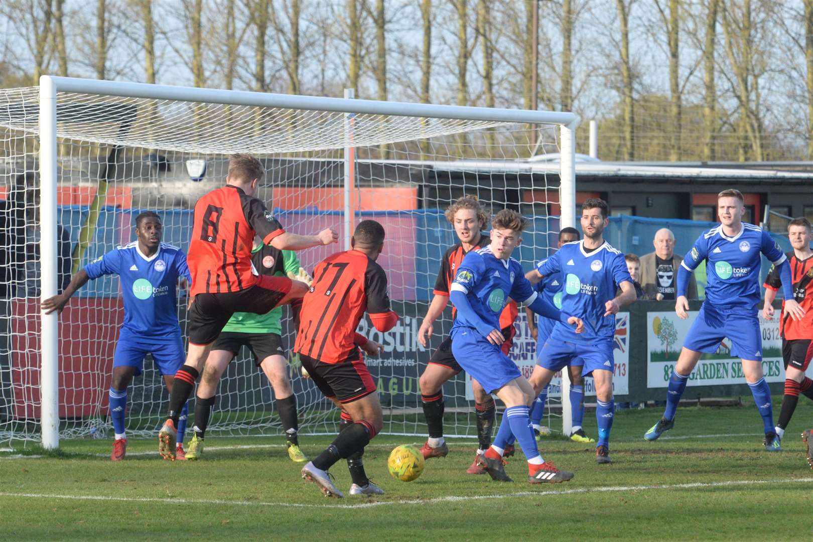 Hythe (in blue) defend their goal away to Sittingbourne Picture: Chris Davey